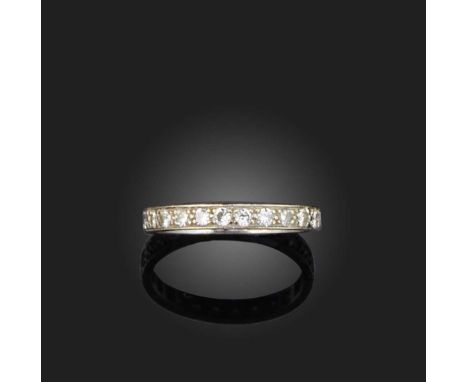 A diamond eternity ring, set with a continuous band of brilliant- and single-cut diamonds, mounted in white gold, the gallery