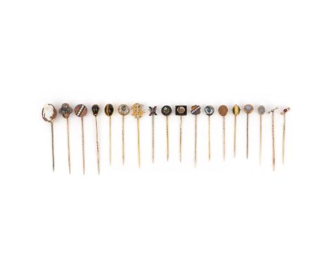 A collection of 18 stick pins, early 20th century, comprising: a stick pin set with three cushion-shaped diamonds; one set wi