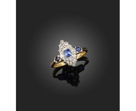 A sapphire and diamond ring, designed as a navette-shaped cluster set with cushion-shaped sapphires and diamonds, the shoulde