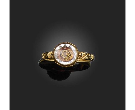 A fine 'Stuart Crystal' and enamel mourning ring, early 18th century, centring on an oval rose-cut rock crystal over entwined