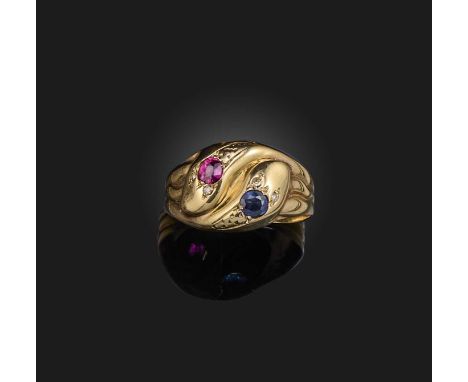 A sapphire and ruby ring, circa 1966, designed as two entwined snakes, their head set with a circular-cut sapphire and ruby r