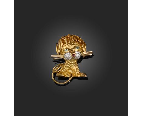 Kutchinsky, a gold, emerald, ruby and diamond brooch, circa 1963, designed as a stylised lion in textured 18ct gold, accented