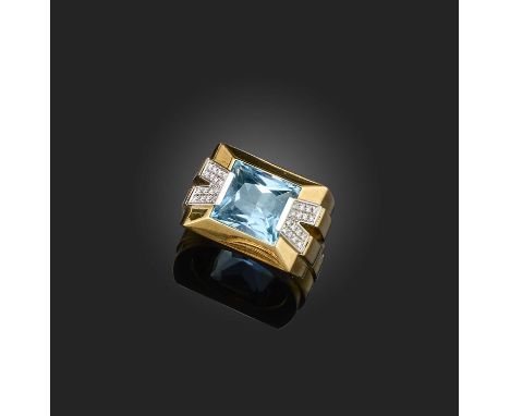 Versace, a gold, blue topaz and diamond ring, set with a rectangular mixed-cut blue topaz, within a geometric gold mount acce