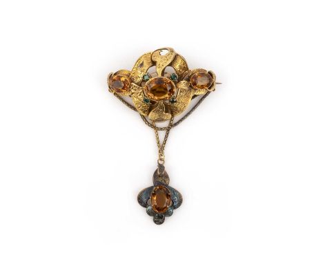 A citrine and emerald brooch, mid 19th century, designed as a ribbon scroll suspending a pendant from festoons of chain, engr