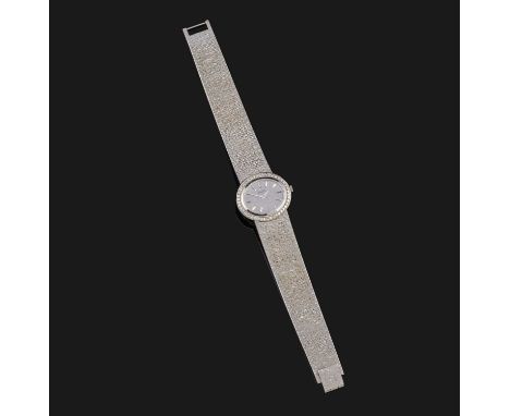 Piaget, a lady's white gold and diamond wristwatch, signed dial with baton numerals, within a bezel set with single-cut diamo