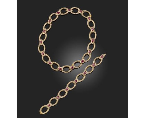 Asprey & Co., a ruby and diamond demi-parure, circa 1977, comprising: a necklace and bracelet, each composed of oval linking,