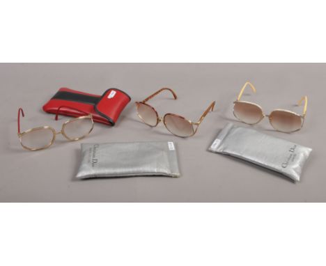 Three cased pairs of ladies Christian Dior sunglasses.