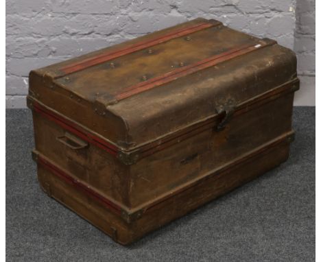 A painted tin travel trunk.