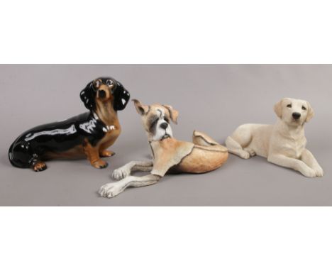 A Kingston ceramic Dachshund, along with a Mutts model of a champ boxer and Sandicast yellow Labrador.&nbsp;