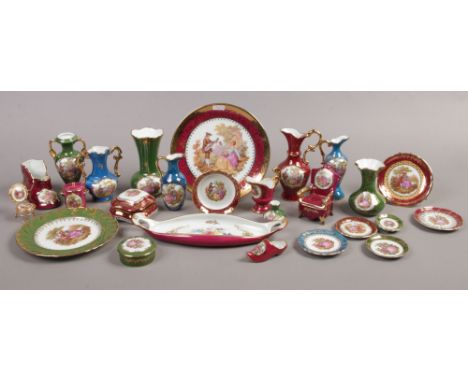 A quantity of Limoges porcelain including vases, trinket boxes, plates etc.