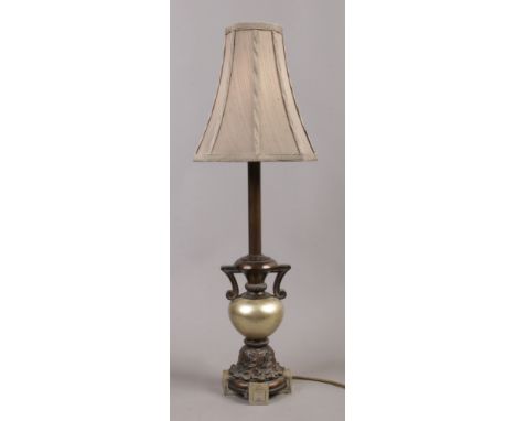 A bronzed effect ornate table lamp height 72cm.