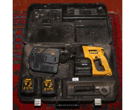 A cased Dewalt DW004 24 volt cordless hammer drill.