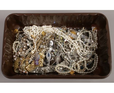 A box of costume jewellery including silver and a mabe pearl two row necklace.