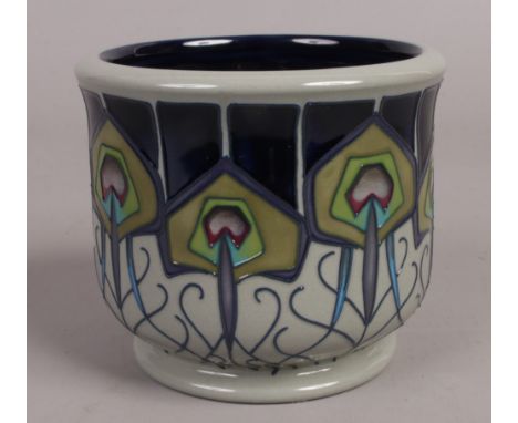 A Moorcroft small planter in the Peacock Parade design, first quality, 8.75cm tall.