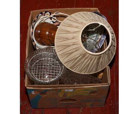 A box of cut crystal crockery and wooden table lamp.