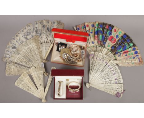 A collection of costume jewellery to include boxed ladies Rotary wristwatch set, along with a collection of bone fans.