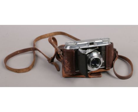 A Voightlander Vito II 35mm folding camera fitted with color - skop 50mm lens in makers leather case.Condition report intende