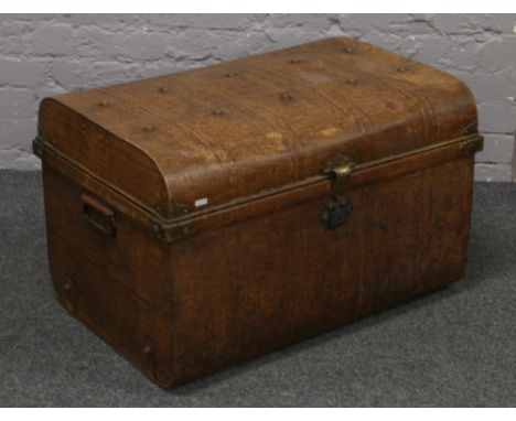 A Henry Bramah &amp; Sons dome top tin trunk with scumble glaze decoration.