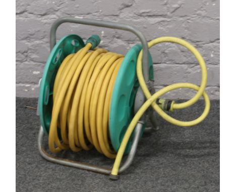 A Hozelock garden hose pipe reel approximately 35 metres in length.