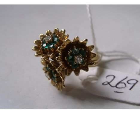 AN 18CT GOLD EMERALD AND DIAMOND SET   modernist triple flowerhead ring approx size 'P' 9.8g inc  