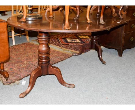 A Georgian mahogany D-end twin-pillar dining table with additional leaf, 117cm by 173cm (open) by 71cm high together with a s