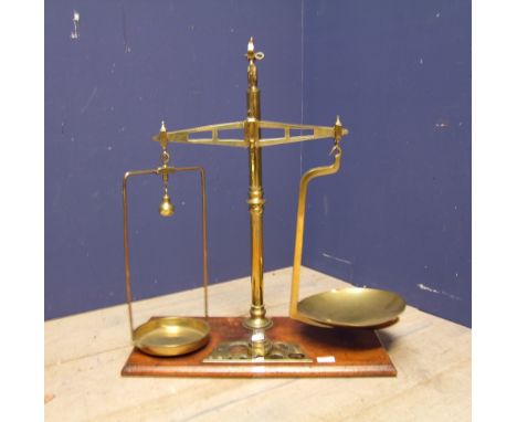 Set of brass hanging scales with weights, maker's mark to brass arm Bartlet &amp; Sons, Bristol 