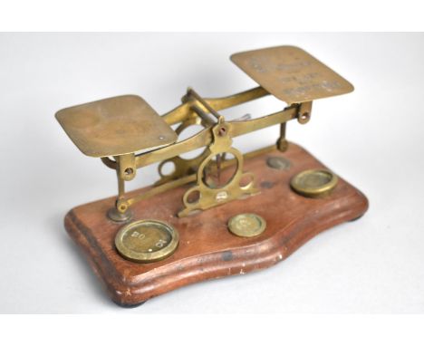 A Set of Edwardian Brass Postage Scales with Weights, Mahogany Serpentine Plinth, 17cms Wide 