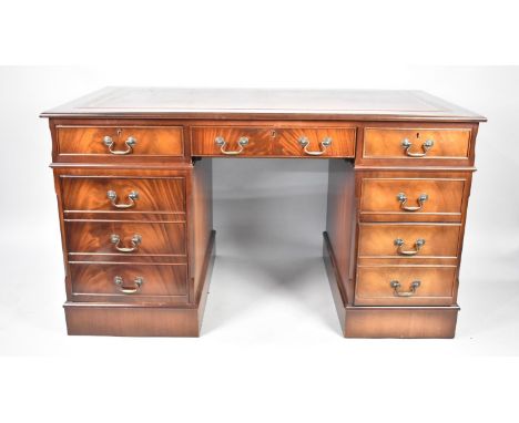 A Late 20th Century Mahogany Kneehole Desk with Red Leather Tooled Top, Centre Pull Out Keyboard Drawer Flanked by Two Drawer