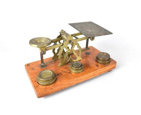 An Edwardian Set of Brass Postage Scales with Weights on Rectangular Wooden Plinth Base, 21cms Wide 