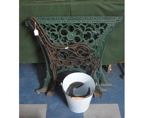 A Pair of Cast Iron Garden Bench Ends together with a Green Painted Pair of Cast Iron Table Ends 