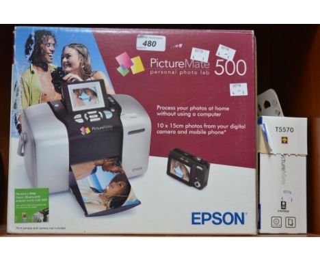 An Epson printer - Picture Mate 500; a box of picture pack print paper