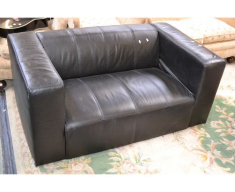 A contemporary two seat leather sofa