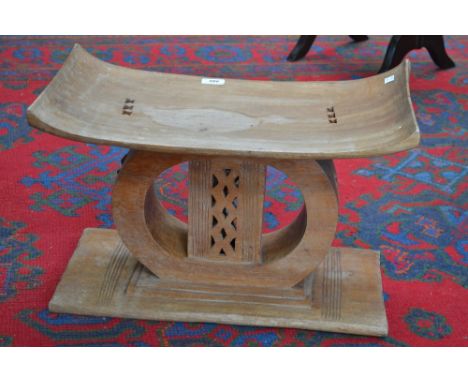 An Ashanti tribal stool; a vernacular footstool; others (7)