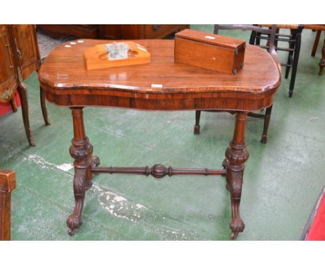 A Victorian  rosewood card table, serpentine fold over top enclosing red baize playing surface, turned fluted and lobed suppo