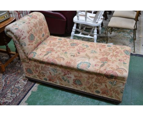 A Victorian day bed, scrolling arm, hinged top, ceramic casters