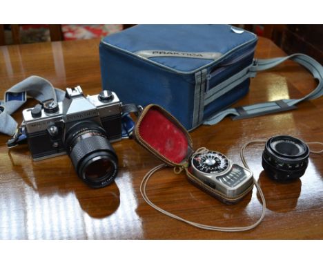 Photography - a Praktica camera; a Carl Zeiss lens, 51:3 5f = 135; another, 2.8150; a light meter