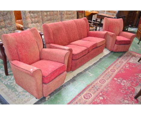 A 1930's 3 piece suite comprising a pair of single seat chairs and a three seat sofa