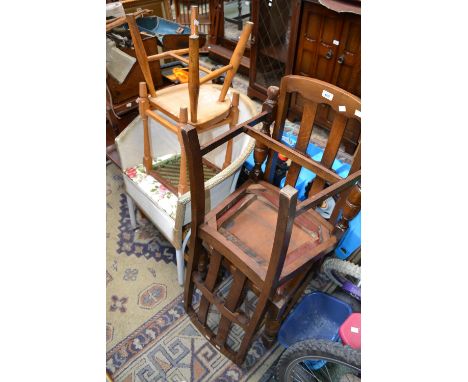 A Lloyd Loom style tub chair; two oak dining chairs; two rope seated stools; another stool (6)