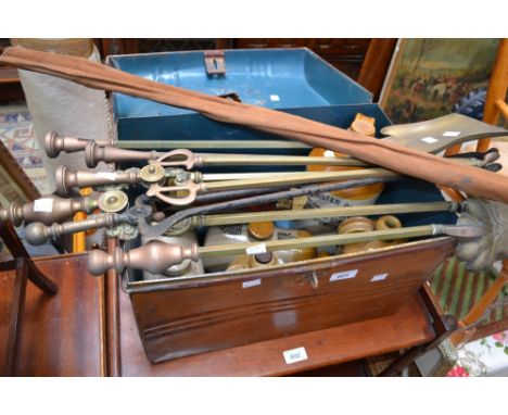 A tin travel trunk; brass fire irons; a manicure set, cased; a split cane fishing rod; Stoneware foot warmers; stoneware flag