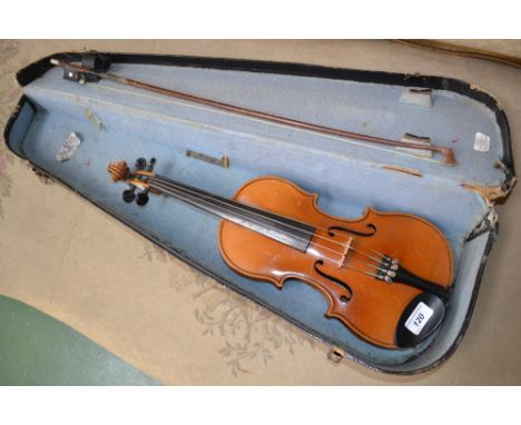 A child's violin, the two-piece back 31.5cm long excluding button, Stradivarius label