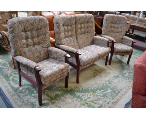 A three piece cottage suite comprising two seat sofa and two armchairs