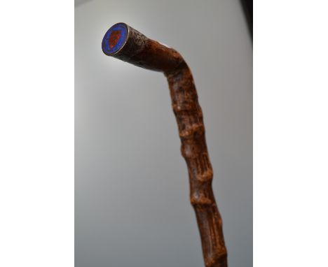 A walking stick, the pommel set with The States of Jersey enamelled coin