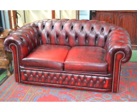 A red leather Chesterfield sofa 