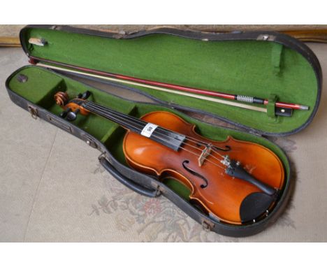 A child's violin, the two-piece back 31cm long excluding button, ebonised tuning pegs, 52.5cm long overall 
