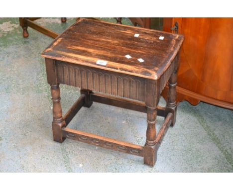 A Priory stool with hidden drawer to frieze