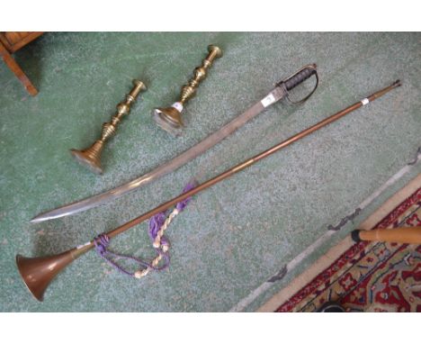 A pair of Victorian brass candlesticks, c.1880; a copper hunting horn; a 20th century sword (4)