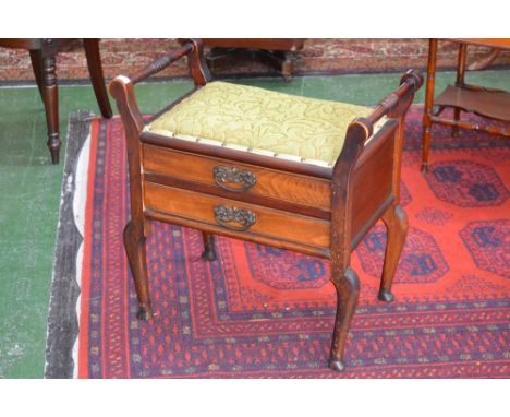 An early 20th century Mahogany piano stool, two drawers to frieze, cabriole legs, stuffed overseat, circa.1900-1910