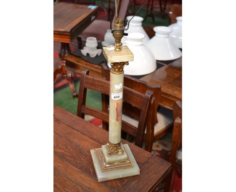 A table lamp with onyx and gilt metal mounted column.