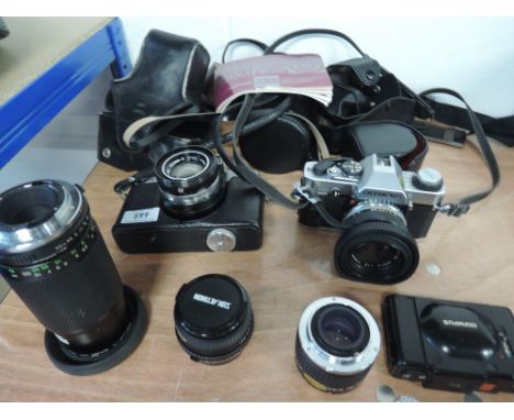 An Olympus OM20 camera, a Fujicarex II camera, an Olympus XA camera, a Sun 80-200mm lens, Tokina doubler, Sun 28mm lens 