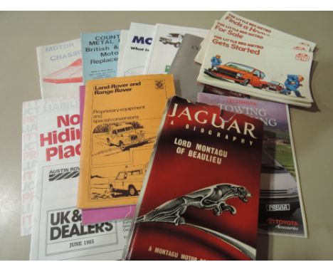 A selection of car dealership manuals brochures leaflets including Jaguar a Biography and Leyland Land Rover 